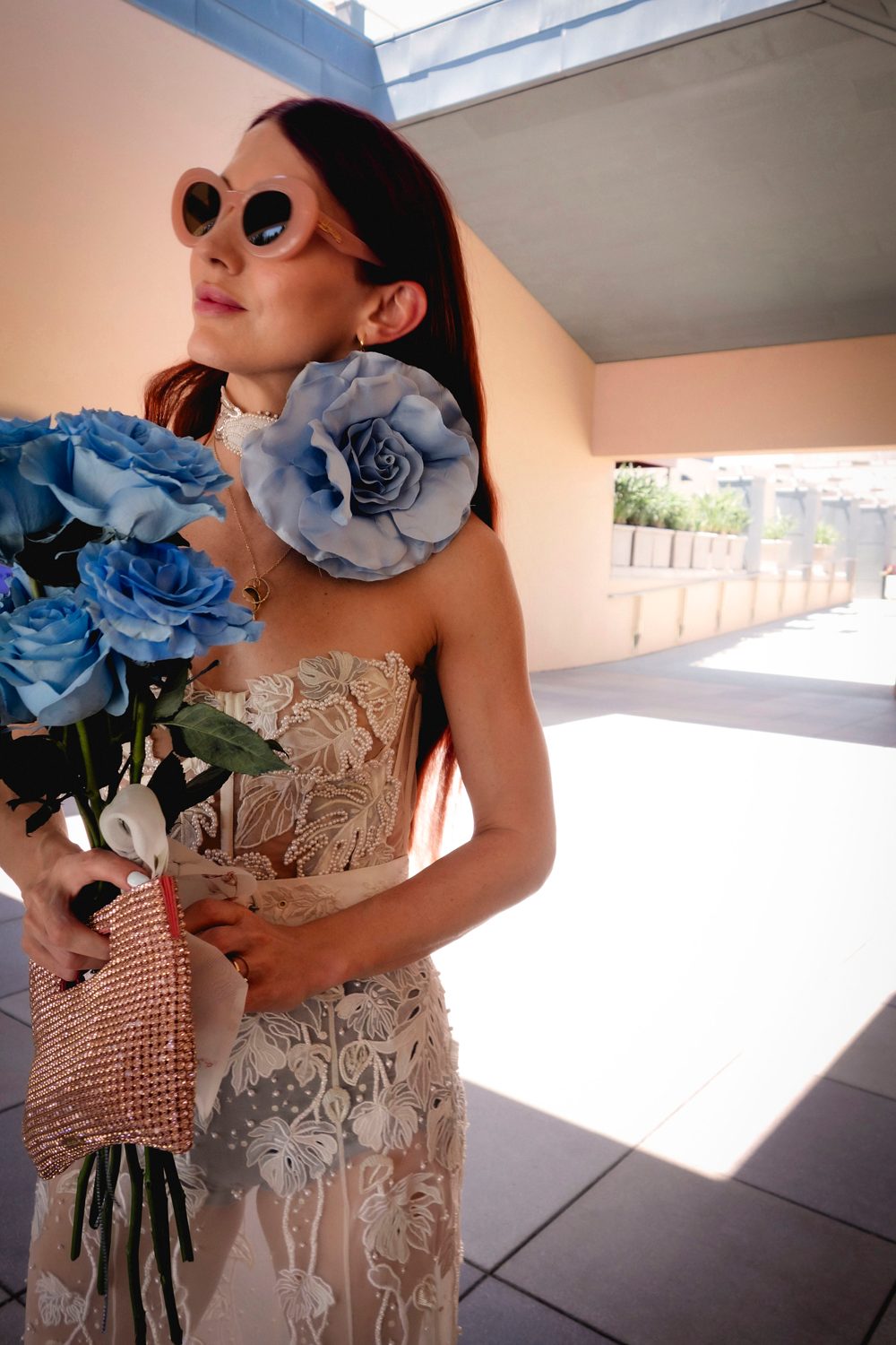 Hermione de Paula bride Madeleine wearing the Monstera Eclipse couture wedding gown with a something blue rose and Celestial Seascape choker - photo 1