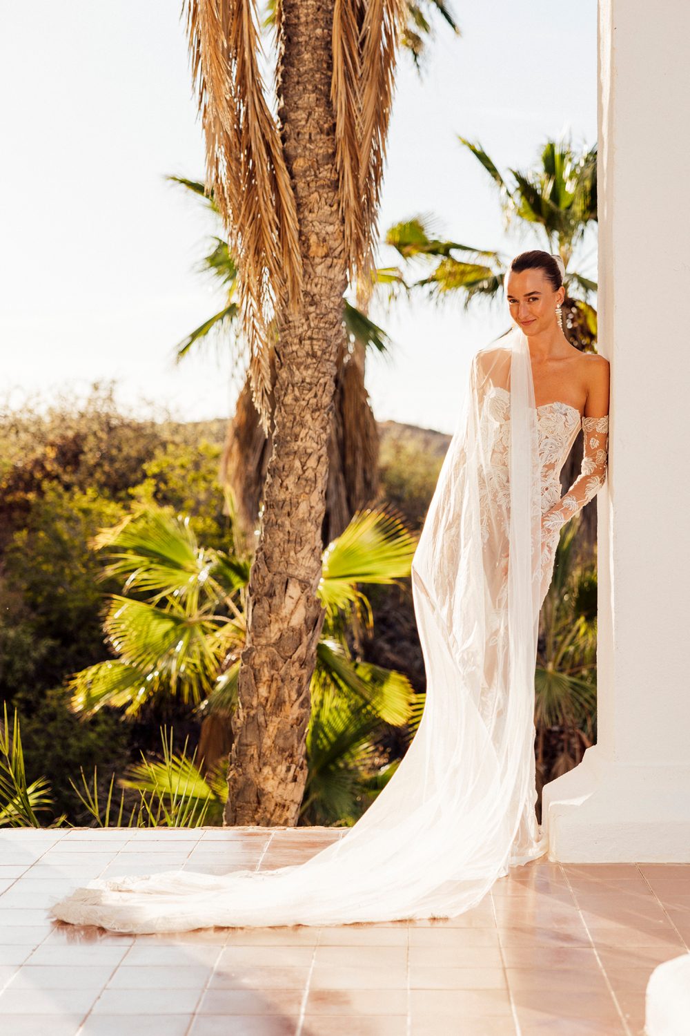 Hermione de Paula bride Sophia wearing the Monstera Eclipse couture wedding gown with Monstera vine gloves and a custom Monstera vine cathedral veil - photo 11